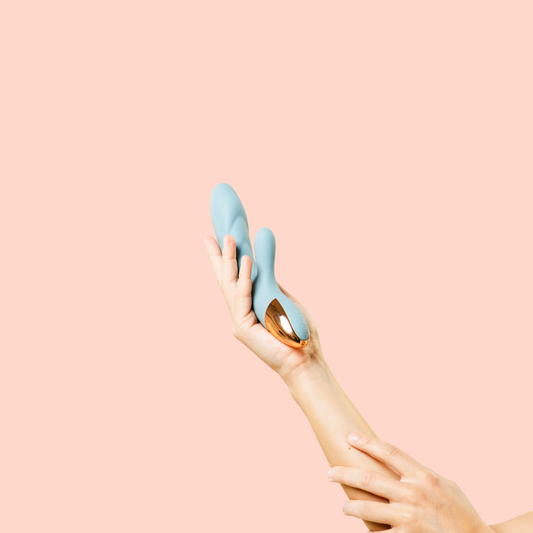 Rabbit vibrator being held in hand for hunnybee vibrators